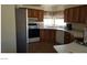Well-equipped kitchen with wood cabinets and modern appliances at 1290 Dalene Ave, Henderson, NV 89002