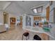 A sunlit kitchen featuring a breakfast bar, stainless steel appliances, and an open floor plan at 1290 Dalene Ave, Henderson, NV 89002