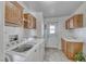 Functional laundry room with modern washer and dryer and ample storage at 1290 Dalene Ave, Henderson, NV 89002