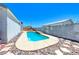 Backyard with refreshing in-ground pool and desert rock landscaping at 1290 Dalene Ave, Henderson, NV 89002