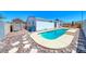 Backyard includes a sparkling in-ground pool, storage shed, and desert landscaping at 1290 Dalene Ave, Henderson, NV 89002