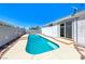 In-ground pool and slider door to the home's interior provide a place for relaxation at 1290 Dalene Ave, Henderson, NV 89002