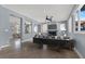 Bright living room with a fireplace, stylish furniture, neutral walls, and an open doorway to the kitchen at 1306 Big Tree Ave, North Las Vegas, NV 89031