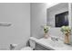 Well-lit bathroom featuring a single sink vanity, neutral walls, and decorative floral accents at 1346 Crystal Hill Ln # 3, Henderson, NV 89012