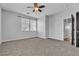 Comfortable bedroom with carpeted floors and ample natural light from large windows at 1346 Crystal Hill Ln # 3, Henderson, NV 89012