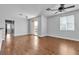 Spacious bonus room with wood floors and a sliding door to a private balcony at 1346 Crystal Hill Ln # 3, Henderson, NV 89012