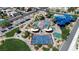Aerial shot of the park featuring a splash pad, playground, basketball court, and picnic areas with shade at 1346 Crystal Hill Ln # 3, Henderson, NV 89012