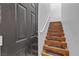 Elegant wooden staircase featuring carpeted steps and a white handrail at 1346 Crystal Hill Ln # 3, Henderson, NV 89012