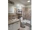 Bathroom featuring a vanity, toilet, and tiled shower at 1590 Raindance Way, Las Vegas, NV 89169