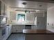 Bright kitchen equipped with ample cabinetry and modern appliances at 1590 Raindance Way, Las Vegas, NV 89169