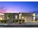 Charming single-Gathering home showcasing meticulous landscaping and a well-maintained two-car garage at 18 Via Tiberina, Henderson, NV 89011