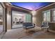 Relaxing outdoor patio features modern furniture, built-in lighting, and dining room views at 18 Via Tiberina, Henderson, NV 89011