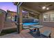 Outdoor patio features modern furniture, tile flooring, stairs, and a view of the pool at 18 Via Tiberina, Henderson, NV 89011