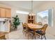 Inviting dining area with wood table and a lot of natural light from the large window at 1816 Eagle Mesa Ave, Henderson, NV 89012