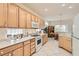 Well-lit kitchen offering matching appliances and view to the dining area at 1816 Eagle Mesa Ave, Henderson, NV 89012