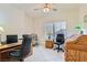 Home office with neutral walls, white-tile floors, two desks, and chair, plus a ceiling fan at 1816 Eagle Mesa Ave, Henderson, NV 89012