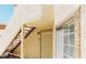 Exterior shot of building with stair case leading to door and windows at 1851 Hillpointe Rd # 1711, Henderson, NV 89074