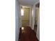 Hallway with hardwood floors and white doors leading to other rooms at 1851 Hillpointe Rd # 1711, Henderson, NV 89074