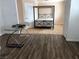 Open bedroom with a metal canopy bed, neutral walls, and a desk at 2217 Santa Ynez Dr, Las Vegas, NV 89104