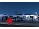 Exterior view of a cozy home with a car parked outside at twilight at 2217 Santa Ynez Dr, Las Vegas, NV 89104