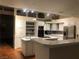 Open kitchen with ample counter space, modern appliances, and bar seating at 2217 Santa Ynez Dr, Las Vegas, NV 89104