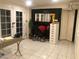 Well-lit room with white tile flooring, glass doors and mirror at 2217 Santa Ynez Dr, Las Vegas, NV 89104