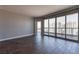 Spacious living room with floor-to-ceiling windows offers abundant natural light and city views, complemented by sleek wood flooring at 222 Karen Ave # 2804, Las Vegas, NV 89109