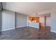 Open living area with wood floors, neutral paint, and a partial view of the kitchen, blending style with functionality at 222 Karen Ave # 2804, Las Vegas, NV 89109