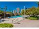 This resort-style pool is surrounded by rocks, palm trees, and lush greenery in a luxurious community at 222 Karen Ave # 2804, Las Vegas, NV 89109