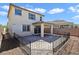 A fenced backyard with a covered patio and space for outdoor entertaining at 2343 Teatro Ave, Henderson, NV 89044