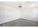 Bedroom features neutral carpet, a ceiling fan, and a closet with double doors at 2343 Teatro Ave, Henderson, NV 89044