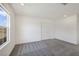 Bedroom with neutral carpet, large window, and closet with double doors at 2343 Teatro Ave, Henderson, NV 89044