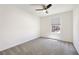 Bright bedroom with neutral carpet, a modern ceiling fan, and ample light at 2343 Teatro Ave, Henderson, NV 89044