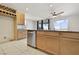 Spacious kitchen with stainless steel appliances, granite countertops, and a kitchen island with a sink at 2343 Teatro Ave, Henderson, NV 89044