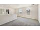 Bright loft area with neutral carpet and natural light from two windows at 2343 Teatro Ave, Henderson, NV 89044