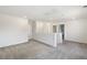 Bright loft area featuring neutral carpet and access to a laundry room at 2343 Teatro Ave, Henderson, NV 89044