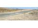 View of desert landscape with mountains and distant buildings at 2343 Teatro Ave, Henderson, NV 89044