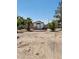 Backyard featuring a shed, desert landscaping, and mature trees, offering an adaptable outdoor area at 2645 Lindell Rd, Las Vegas, NV 89146