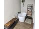Bathroom features a modern freestanding tub and wood-look floors at 2645 Lindell Rd, Las Vegas, NV 89146