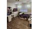 Well-lit bedroom with a large window, desk, and dresser, providing ample storage and workspace at 2645 Lindell Rd, Las Vegas, NV 89146