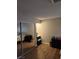 Bedroom with wood floors, vanity, and large mirrored closet at 2645 Lindell Rd, Las Vegas, NV 89146