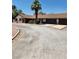 Home featuring a large driveway, mature trees, and a spacious two car garage at 2645 Lindell Rd, Las Vegas, NV 89146