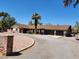 Spacious property boasts an oversized driveway leading to an attached garage and mature palm trees at 2645 Lindell Rd, Las Vegas, NV 89146