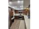 Modern kitchen features updated appliances, sleek countertops, and wood finished cabinetry at 2645 Lindell Rd, Las Vegas, NV 89146