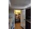 Walk-in pantry features wood floors, wire shelving, and white door at 2645 Lindell Rd, Las Vegas, NV 89146