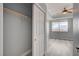 Bedroom with gray walls, wood flooring, tray ceiling, and closet with sliding door at 27 E Agate Ave # 505, Las Vegas, NV 89123