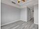 Bright bedroom with gray walls, white trim, and light gray hardwood floors at 27 E Agate Ave # 505, Las Vegas, NV 89123