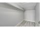 Walk-in closet with gray walls, wood flooring, built-in clothing racks, and ample storage space at 27 E Agate Ave # 505, Las Vegas, NV 89123