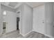 Hallway view including full sized laundry and entrance to bathroom at 27 E Agate Ave # 505, Las Vegas, NV 89123