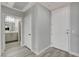 Hallway with neutral walls leading to a bathroom with modern vanity at 27 E Agate Ave # 505, Las Vegas, NV 89123